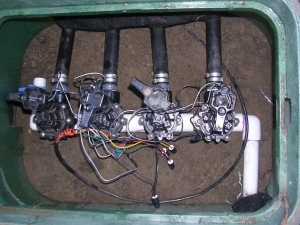 A complex mechanical assembly with multiple connected components and wires.
